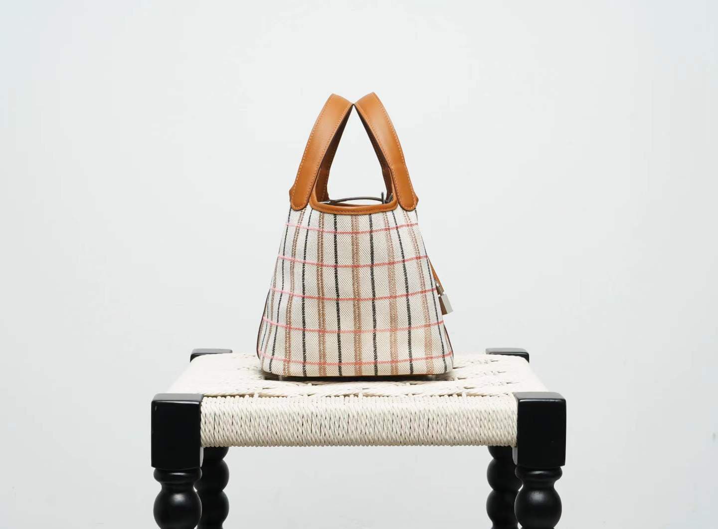 LINJIN LUXURY Picotin Lock 18 style bag in gold leather and plaid canvas, displayed on a natural woven stool against a clean white background - 3