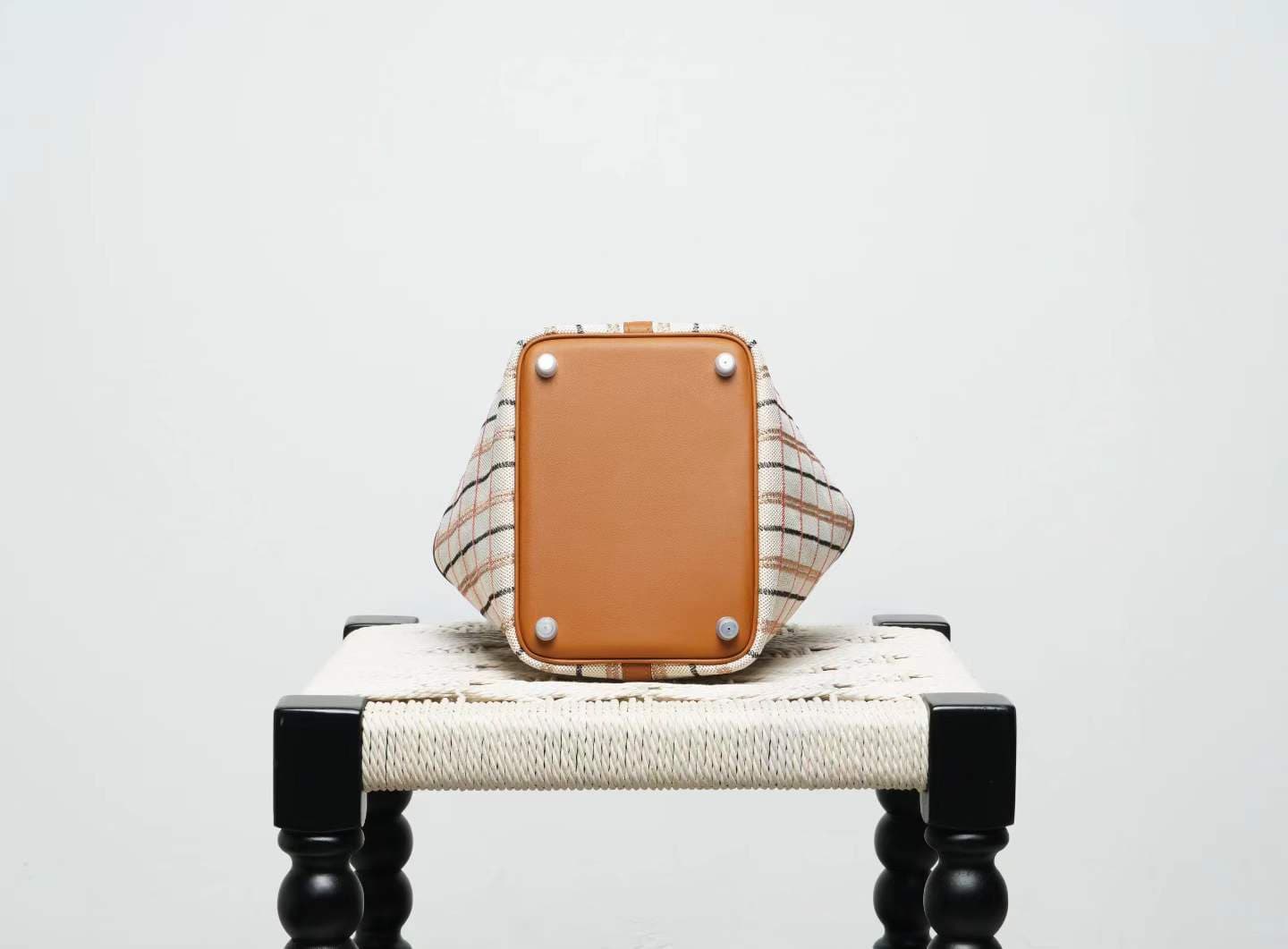 LINJIN LUXURY Picotin Lock 18 style bag in gold leather and plaid canvas, displayed on a natural woven stool against a clean white background - 6