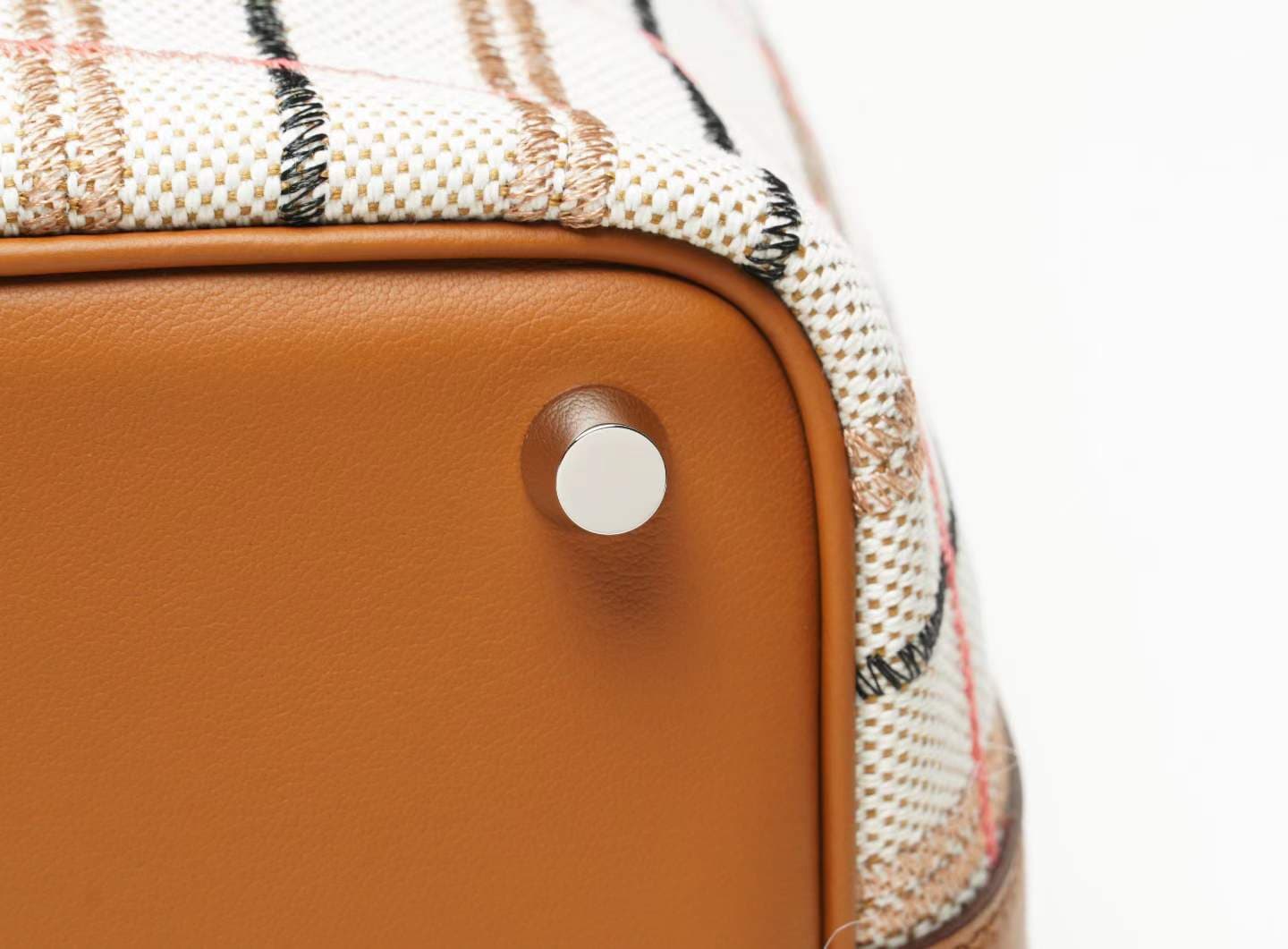 LINJIN LUXURY Picotin Lock 18 style bag in gold leather and plaid canvas, displayed on a natural woven stool against a clean white background - 7