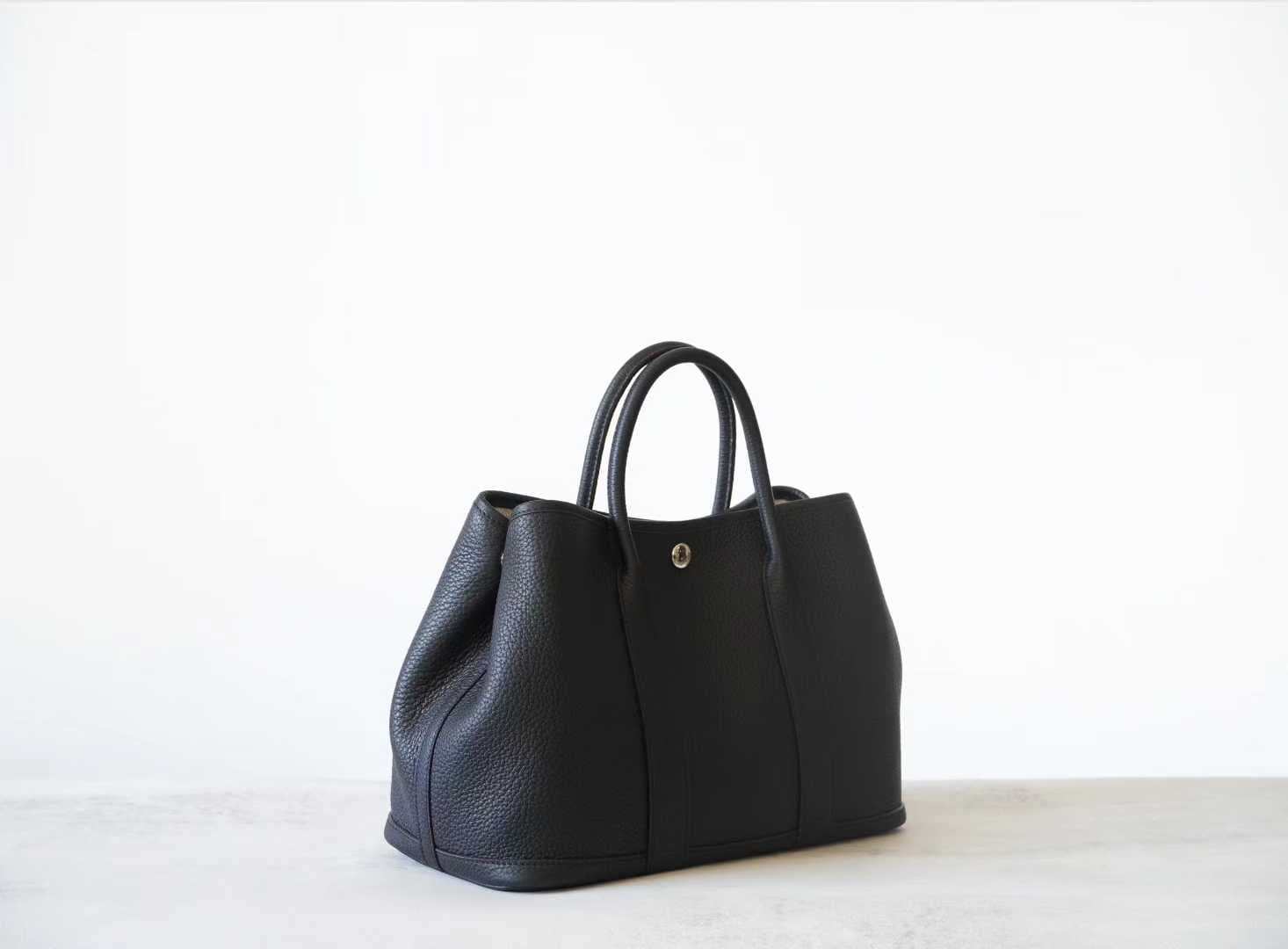 Front view of LINJIN LUXURY Garden Party 30 tote bag in Gold Togo leather, featuring white contrast stitching and snap closure on a white background - 3