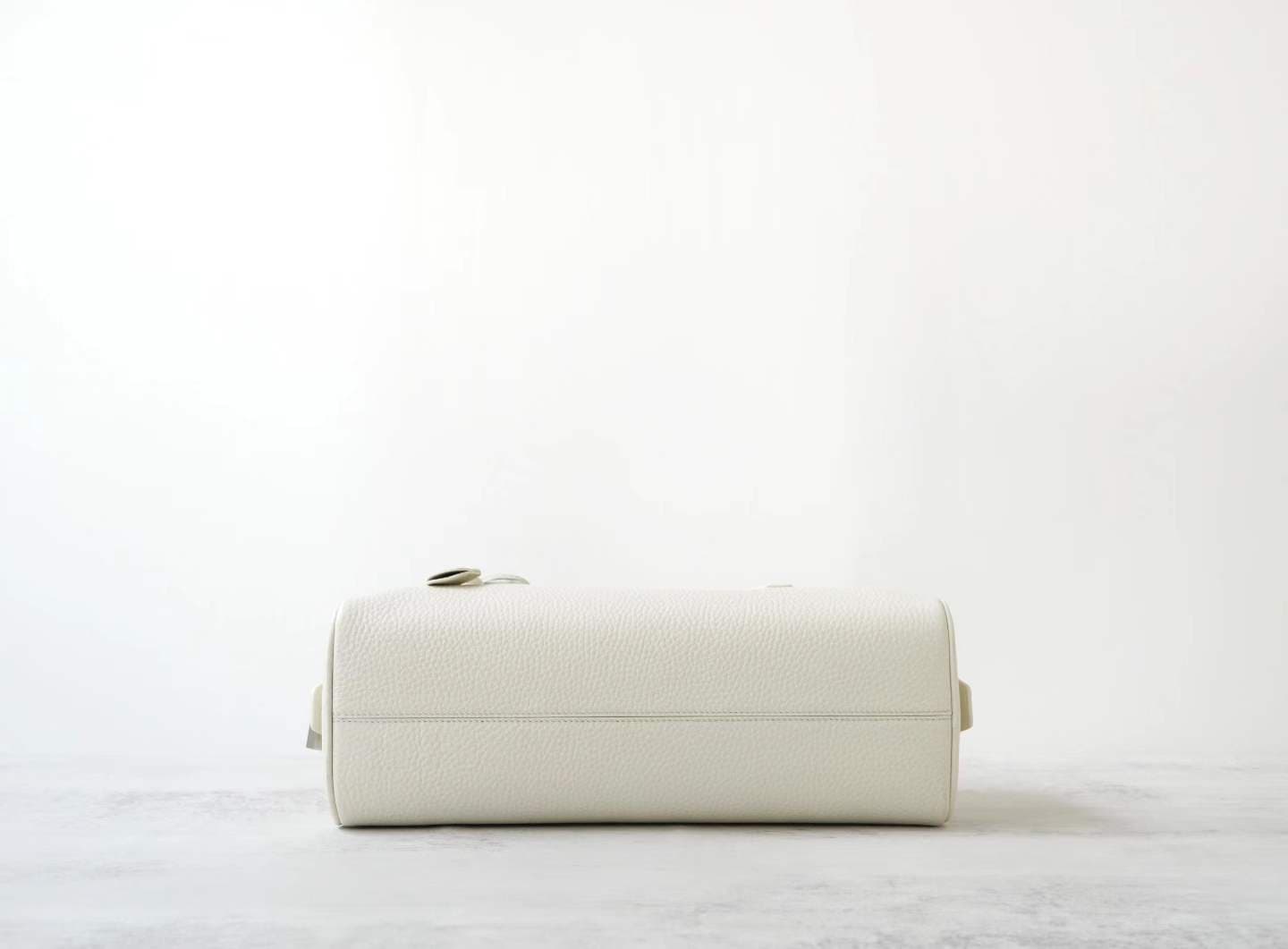 Front view of LINJIN LUXURY Paris-Bombay 35 doctor bag in black Togo leather, featuring an elongated silhouette and tall handles on a white background - 4