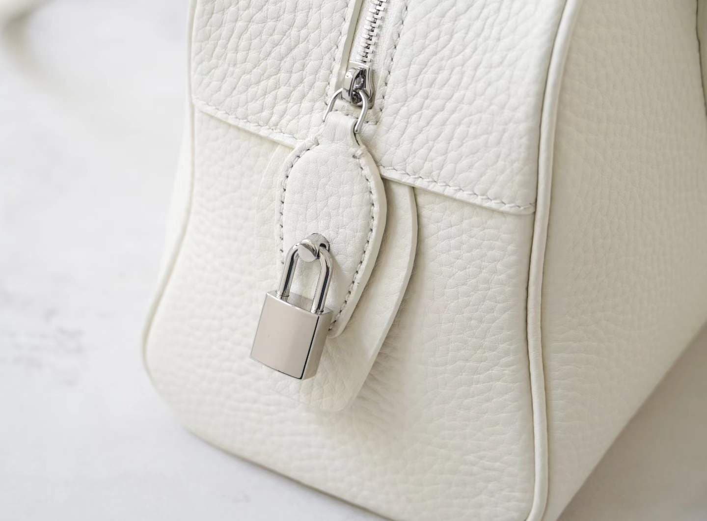 Front view of LINJIN LUXURY Paris-Bombay 35 doctor bag in black Togo leather, featuring an elongated silhouette and tall handles on a white background - 5