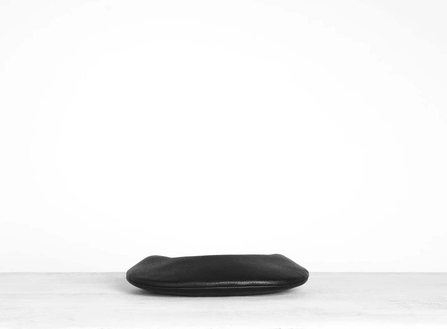 Linjin Luxury black pebbled deerskin lambskin crescent moon bag with single loop top handle and zip closure, minimal silhouette, displayed on a white surface - 3