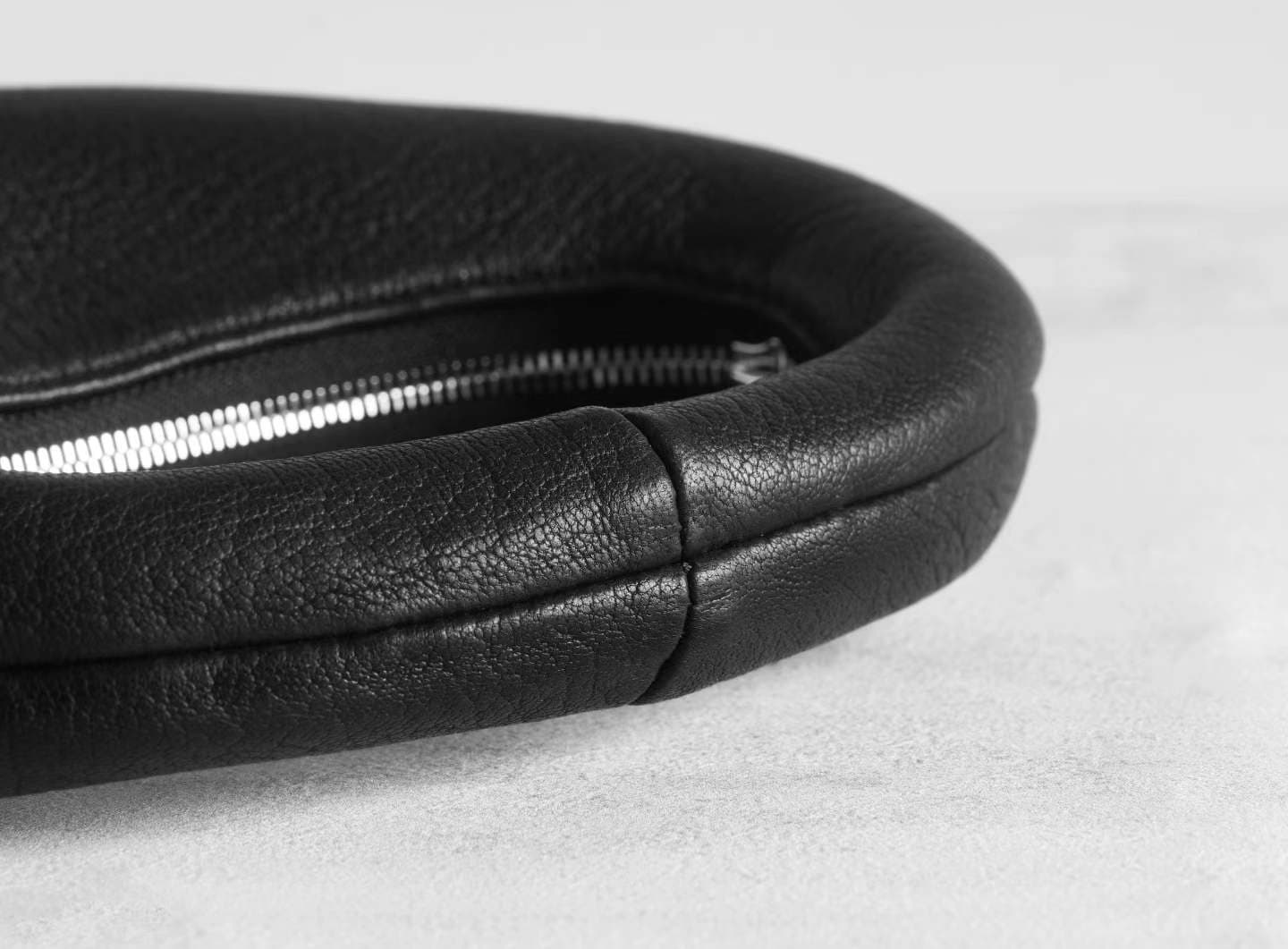 Linjin Luxury black pebbled deerskin lambskin crescent moon bag with single loop top handle and zip closure, minimal silhouette, displayed on a white surface - 6