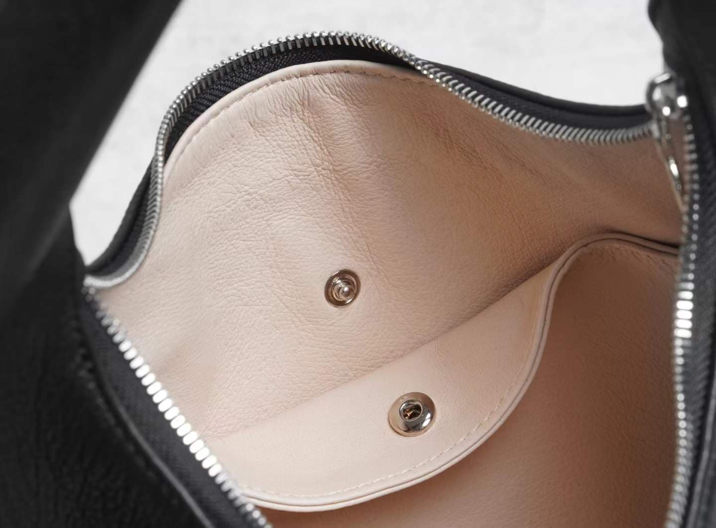 Linjin Luxury black pebbled deerskin lambskin crescent moon bag with single loop top handle and zip closure, minimal silhouette, displayed on a white surface - 7