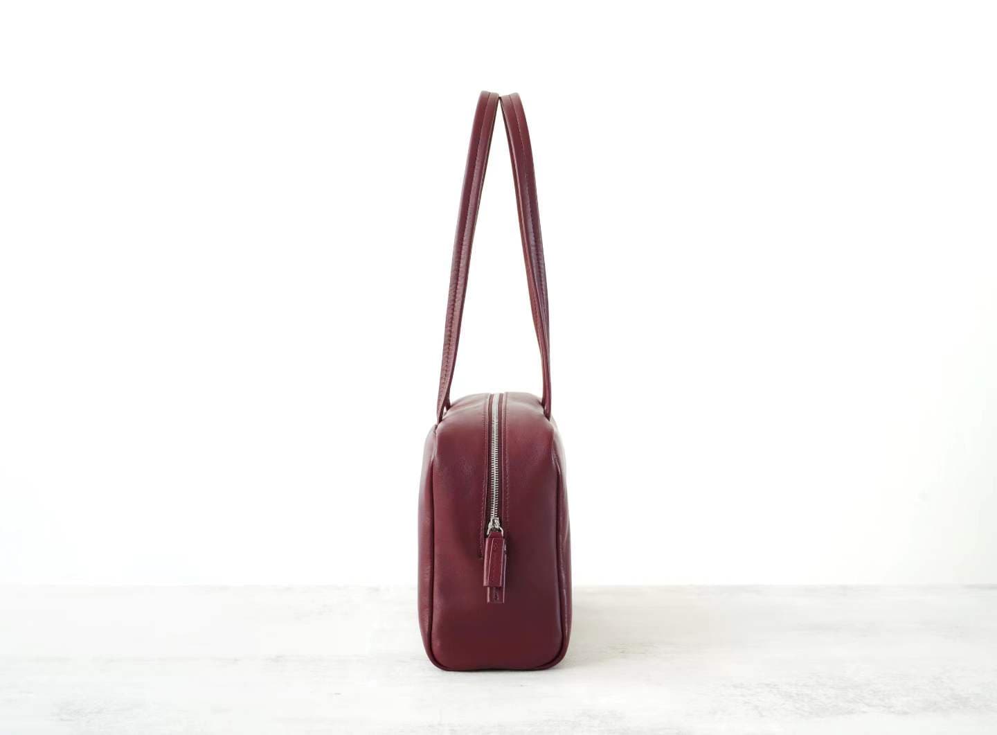 Linjin Luxury burgundy smooth cowhide leather shoulder bag with slim flat handles and double silver-tone zip closure, minimal logo-free design, on a white background - 3